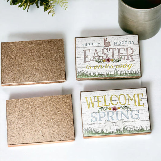 Decorative signs with Easter and spring text on a white surface.