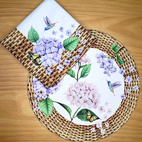 Woven placemat with floral and butterfly design on a wooden surface
